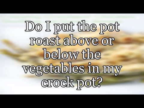 Do I put the pot roast above or below the vegetables in my crock pot?